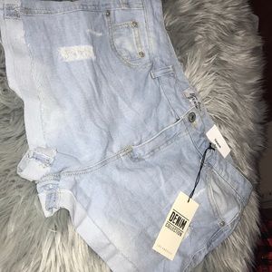Brand new tags still on denim shorts